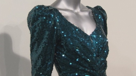 A glittering sea-green sequinned gown, designed by Catherine Walker.