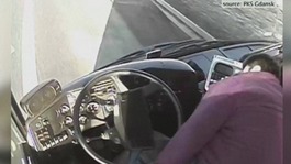 The bus driver slumps in his seat before falling to the floor in the video.