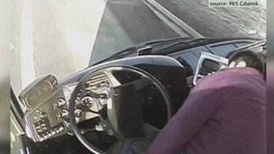 The bus driver slumps in his seat before falling to the floor in the video.