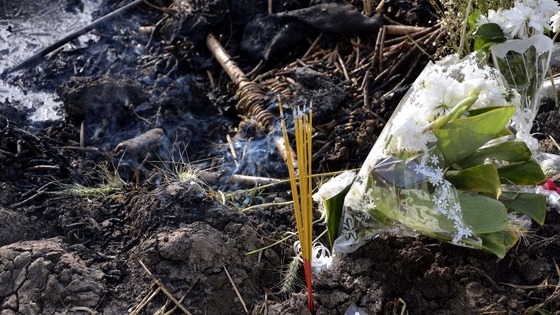 Flowers and incense are laid at the site of the hot air balloon crash in Luxor, Egypt