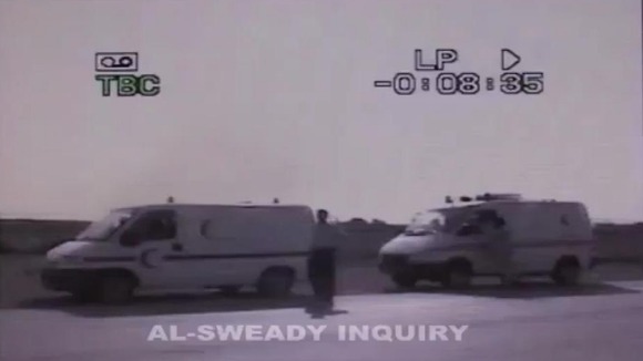 The bodies of Iraqi men are transported in ambulances