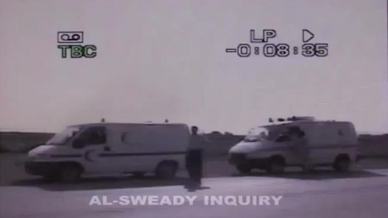 The bodies of Iraqi men are transported in ambulances