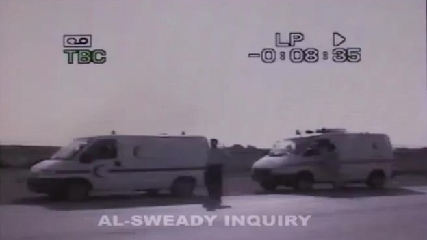 The bodies of Iraqi men are transported in ambulances