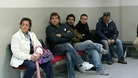 People wait to be seen at an unemployment office in Spain