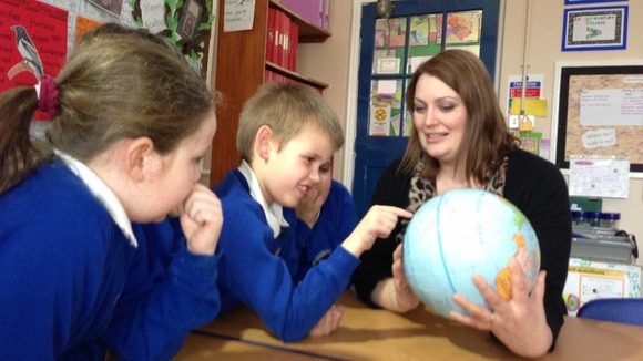 Joshua looking at the globe