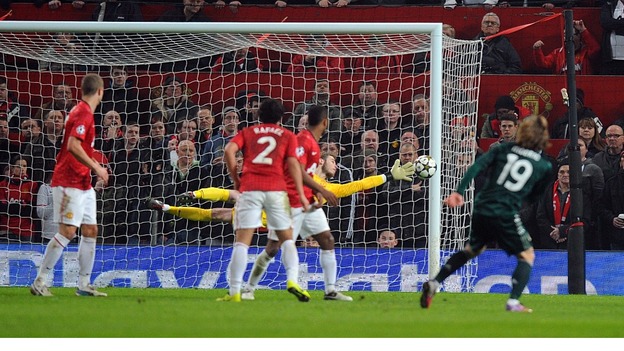 Real Madrid's Luka Modric (right) scores his side's first goal