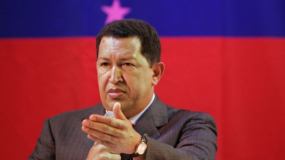 President Hugo Chavez greets supporters during a campaign rally in Caracas last year