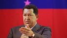 President Hugo Chavez greets supporters during a campaign rally in Caracas last year