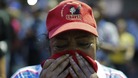 A woman reacts to the news of the death of Hugo Chavez