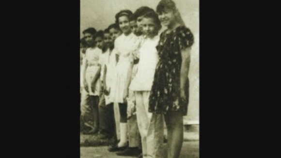 Hugo Chavez (second right) in Julian Pino Primary School in Sabaneta, Barinas State