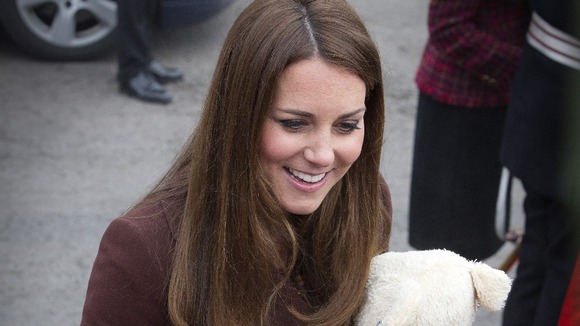 The Duchess of Cambridge accepts a teddy bear from the crowds in Grimbsy - but is it for a boy or a girl?