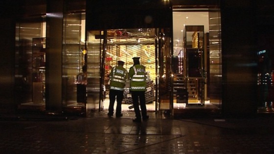 Police around the entrance to the Gucci store in Sloane Square