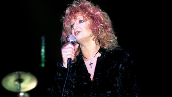 Welsh rock singer Bonnie Tyler performing on stage at a charity gig for Unicef at London's Astoria in 1996