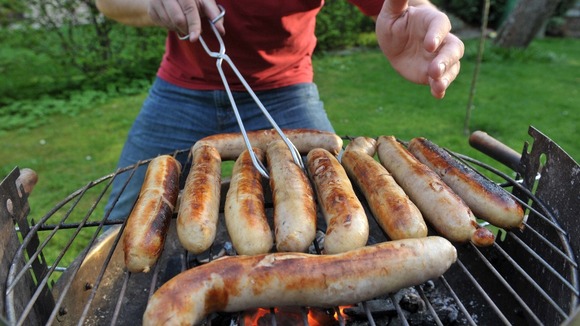 Sausages on a barbeque.