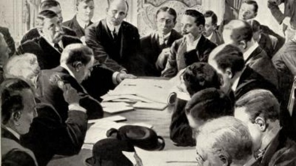 Men sitting round a table