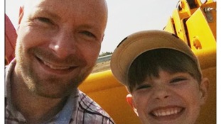 Finn Robinson, 8, with dad Adam.