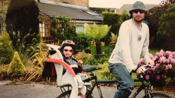 Adam Robinson on his bike with Finn in the child seat.