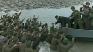 Soldiers cheer Kim Jong-un as he leaves the military base