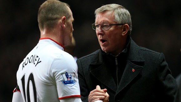 Manchester United manager Sir Alex Ferguson and Wayne Rooney last year
