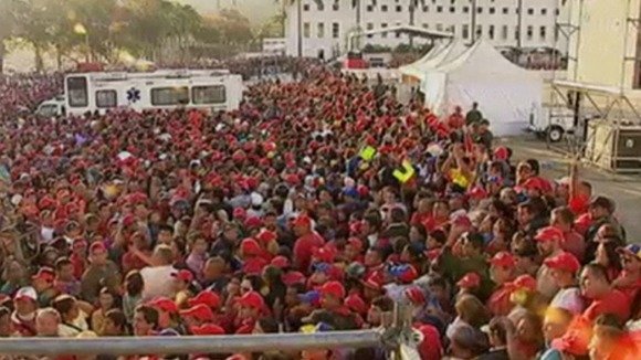 A massive crowd has gathered outside the Military Academy where the body of Hugo Chavez has lain in state since his death