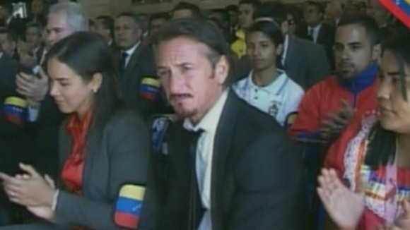 Sean Penn listening to the Reverend Jesse Jackson