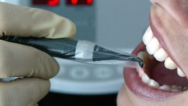 A dentist carries out treatment