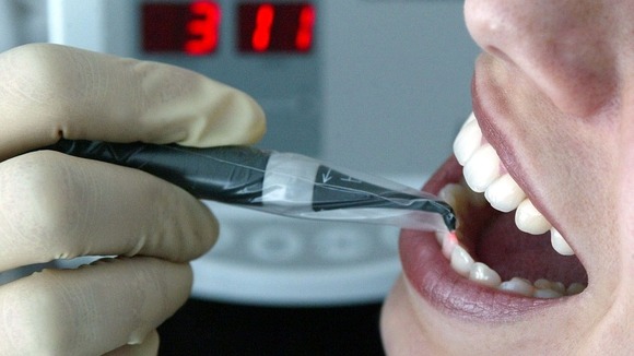 A dentist carries out treatment