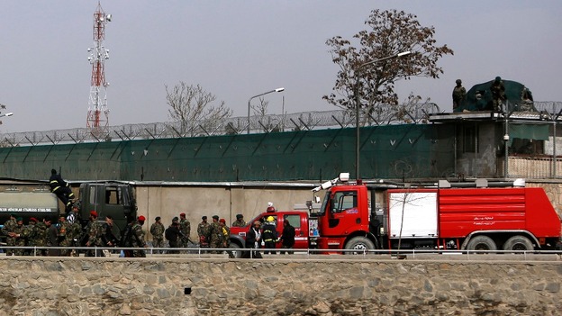 Afghan National Army soldiers investigate at the site of an attack 