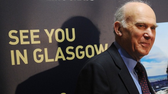 Business Secretary Vince Cable tours the exhibition stands at the Liberal Democrat spring conference
