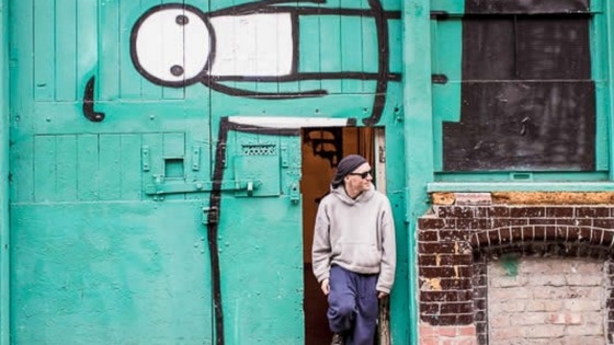 Artist Stik outside his studio