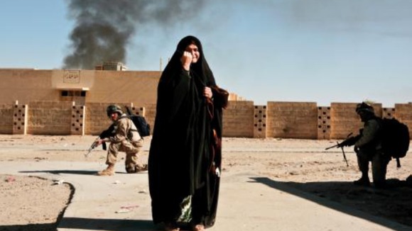 An Iraqi woman caught up in fighting between insurgents and Coalition troops, Ubaydi, 2005