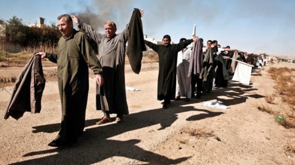 Residents of Ubaydi flee their homes, as US Marines occupy their town, 2005