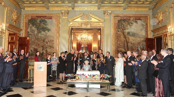 Queen Elizabeth II, Head of the Commonwealth signs the Commonwealth Charter at a reception at Marlborough House.