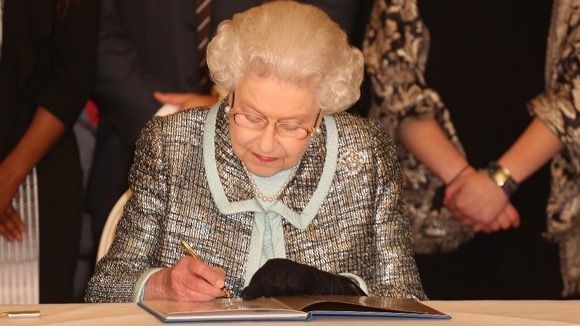 The Queen signs the Commonwealth's historic charter.