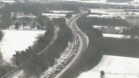 Traffic can be seen queuing for miles because of the poor weather conditions