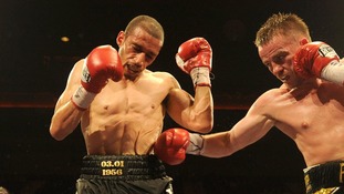 Curtis Woodhouse is punched by Frankie Gavin during the WBO Intercontinental Welterweight Championship bout in 2011