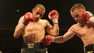 Curtis Woodhouse is punched by Frankie Gavin during the WBO Intercontinental Welterweight Championship bout in 2011
