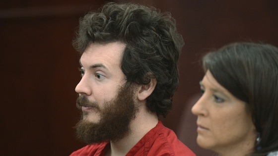 James Holmes listens with public defender Tamara Brady at his arraignment in Centennial, Colorado 