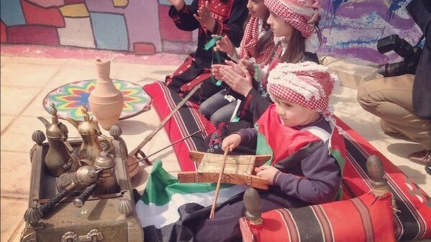 Pupils at Mahis Secondary School give their Royal visitors a traditional welcome