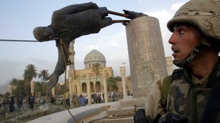A statue of Saddam Hussein is pulled down in central Baghdad in April 9, 2003.