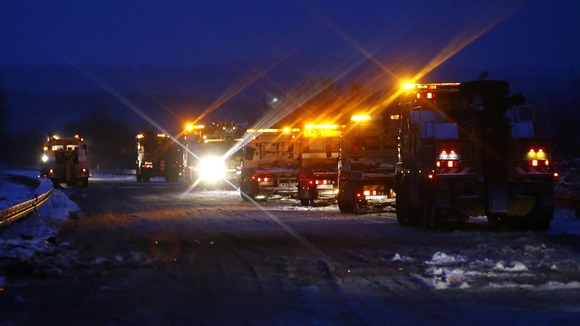 Tow trucks arrive at the scene