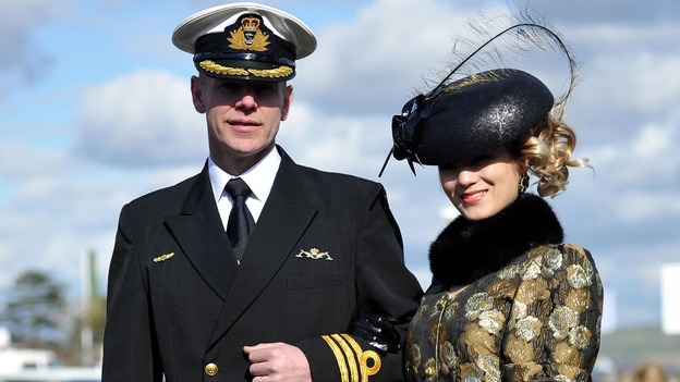 Mimi Theobald from Inverness arrives for Ladies Day with her husband Doug Theobald, a retired Royal Australian Navy officer