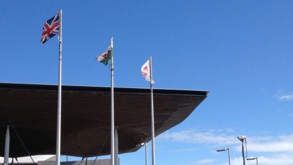 Red Dragon flag flying alongside the Union flag outside the Senedd