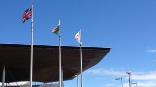 Red Dragon flag flying alongside the Union flag outside the Senedd