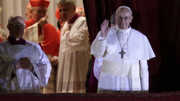 Cardinal Jorge Mario Bergoglio, who was elected as the new pope today, waves to the St Peter's Square crowd.