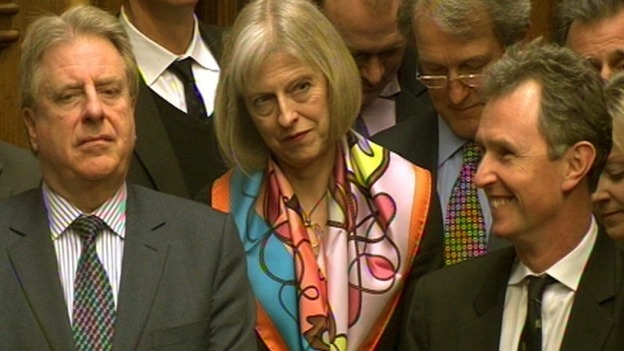 Theresa May looks on as Labour party leader Ed Miliband spoke during Prime Minister's Questions yesterday