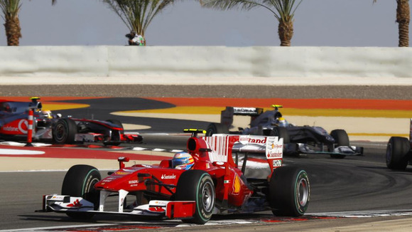Ferrari driver Fernando Alonso of Spain leads a group of cars in the early stages of the Bahrain F1, 2010