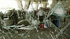 View through the damaged windscreen of a bus shows in central Damascus in 2012