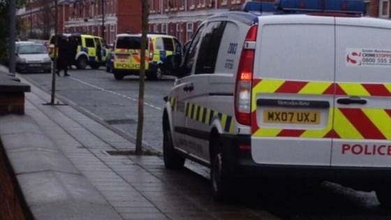 Police have surrounded the house on North Lonsdale Street in Gorse Hill.