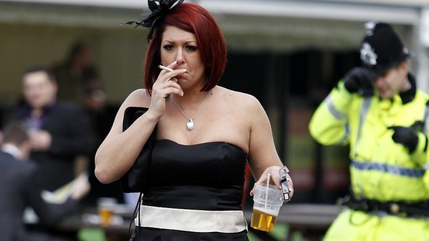 A racegoer on Ladies' Day during day two of the 2012 John Smith's Grand National meeting at Aintree Racecourse, Liverpool